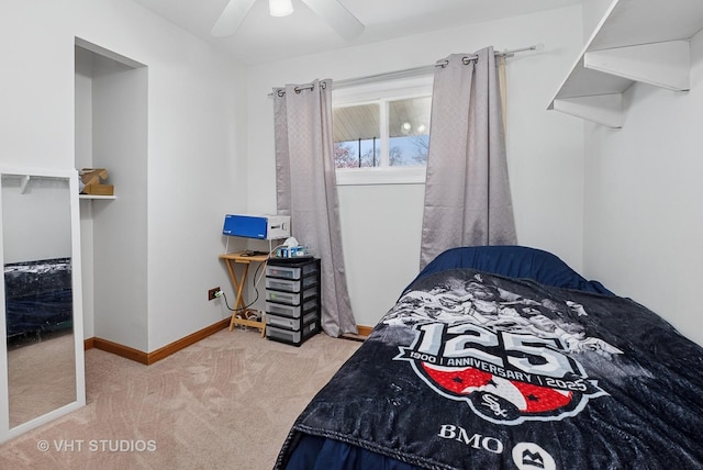 carpeted bedroom with baseboards and ceiling fan