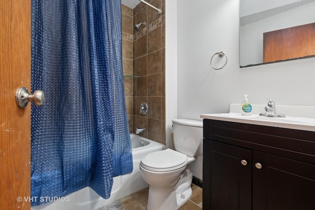 full bath with toilet, vanity, tile patterned floors, and shower / tub combo