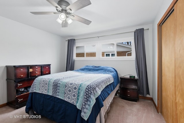 bedroom featuring carpet flooring, baseboards, a closet, and ceiling fan