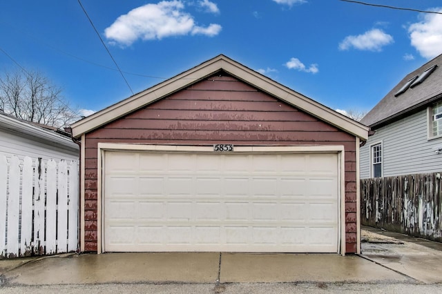 detached garage with fence