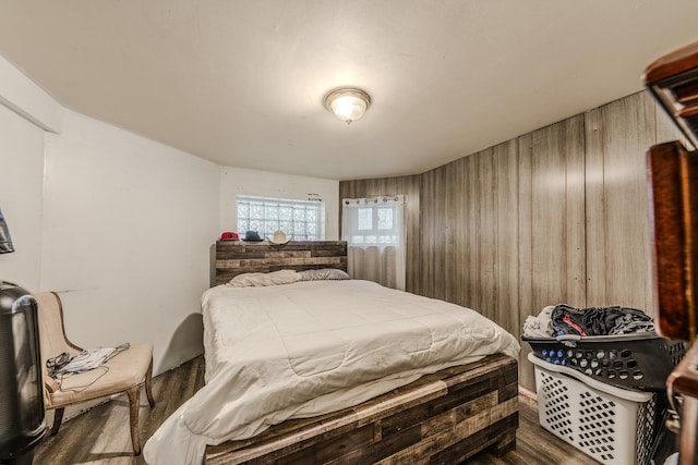 1317 N Harding Ave, Chicago, IL 60651 - bedroom featuring wood walls and dark wood-type flooring