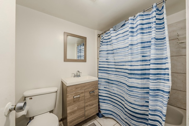 1317 N Harding Ave, Chicago, IL 60651 - full bathroom featuring toilet, vanity, tile patterned floors, and shower / bath combo