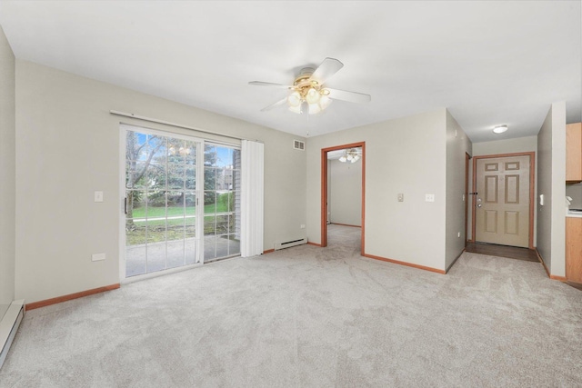 1545 W Crystal Rock Ct Unit 1B, Round Lake Beach, IL 60073 - empty room with light colored carpet, baseboards, a ceiling fan, and a baseboard heating unit