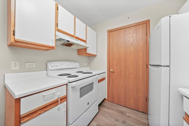 1545 W Crystal Rock Ct Unit 1B, Round Lake Beach, IL 60073 - kitchen with white cabinets, white appliances, under cabinet range hood, light countertops, and light wood-style floors