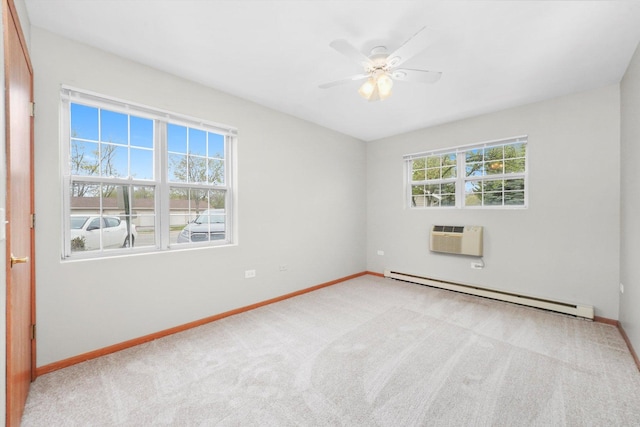 1545 W Crystal Rock Ct Unit 1B, Round Lake Beach, IL 60073 - unfurnished room with baseboards, a wall unit AC, a healthy amount of sunlight, and a baseboard heating unit
