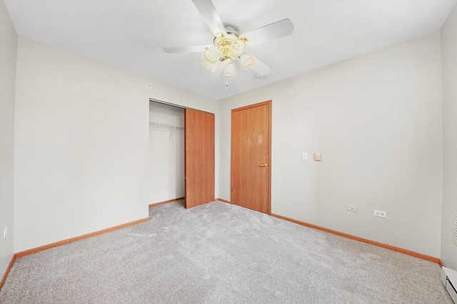 1545 W Crystal Rock Ct Unit 1B, Round Lake Beach, IL 60073 - unfurnished bedroom with a closet, light carpet, baseboards, and ceiling fan