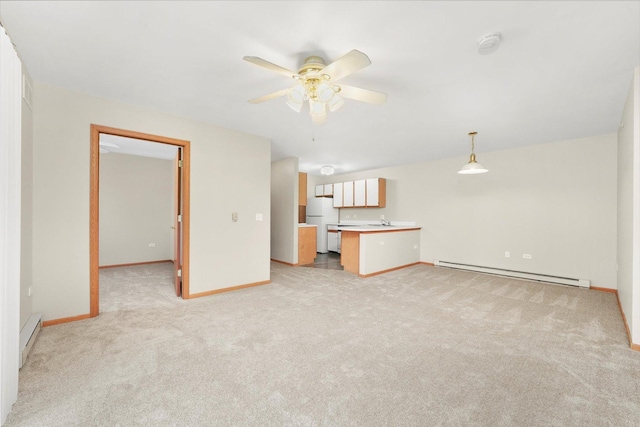1545 W Crystal Rock Ct Unit 1B, Round Lake Beach, IL 60073 - unfurnished living room featuring light colored carpet, baseboards, and a baseboard heating unit