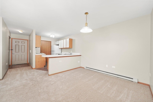 1545 W Crystal Rock Ct Unit 1B, Round Lake Beach, IL 60073 - kitchen featuring a baseboard radiator, light carpet, light countertops, and freestanding refrigerator