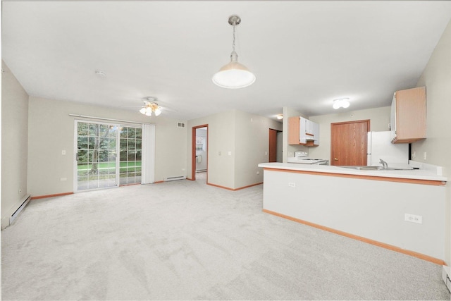 1545 W Crystal Rock Ct Unit 1B, Round Lake Beach, IL 60073 - kitchen with a baseboard heating unit, baseboards, and freestanding refrigerator