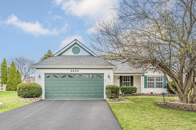 single story home with a front yard, driveway, a shingled roof, and an attached garage
