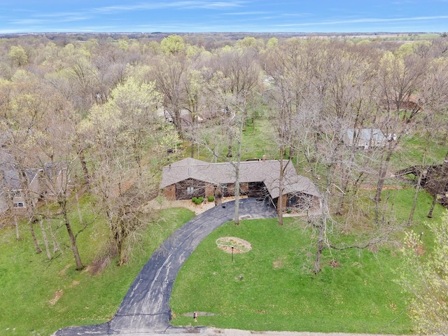 birds eye view of property with a forest view