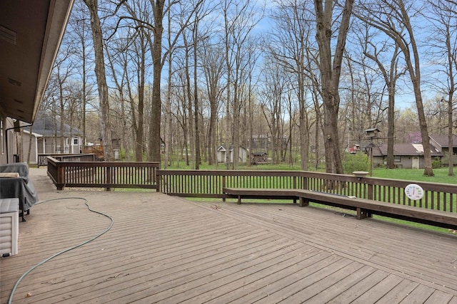wooden terrace with a residential view