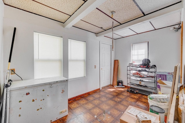 interior space featuring baseboards