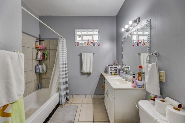 full bathroom with tile patterned flooring, vanity, toilet, and shower / bath combo with shower curtain