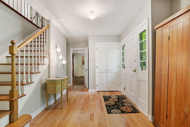 36W525 Wild Rose Rd, Saint Charles, IL 60174 - foyer with light wood-type flooring, stairway, and baseboards