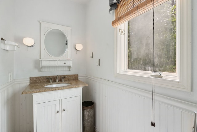 36W525 Wild Rose Rd, Saint Charles, IL 60174 - bathroom featuring a wainscoted wall, vanity, and a decorative wall