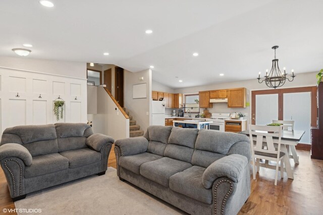 35720 N Laurel Ave, Ingleside, IL 60041 - living room featuring light wood-style flooring, a chandelier, recessed lighting, stairway, and lofted ceiling