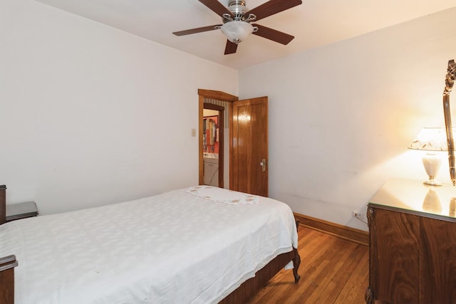 bedroom featuring baseboards, ceiling fan, and wood-type flooring