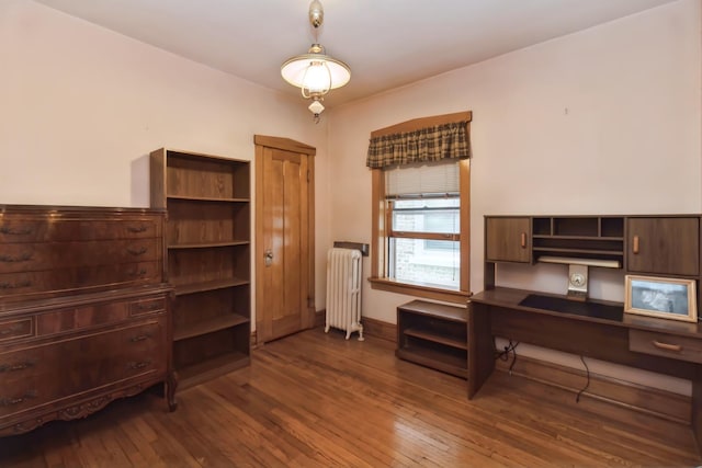 office space featuring hardwood / wood-style floors and radiator