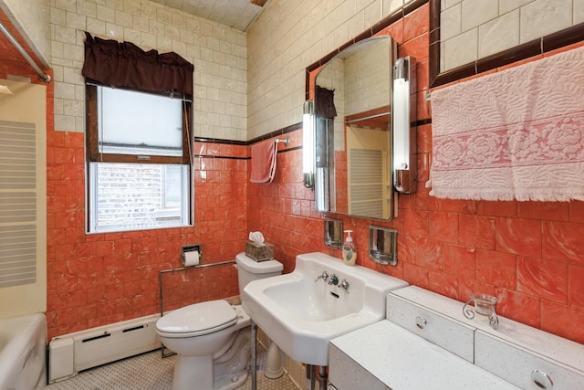 bathroom with backsplash, toilet, tile walls, and a baseboard heating unit