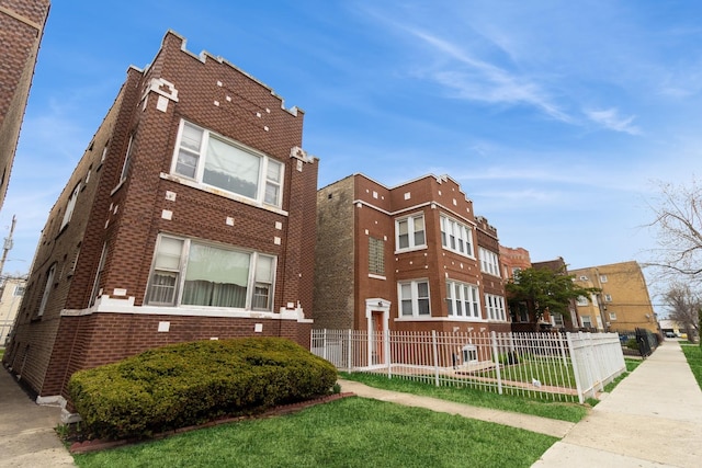 view of building exterior with fence