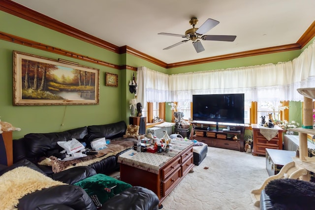living room with ceiling fan, crown molding, and light colored carpet