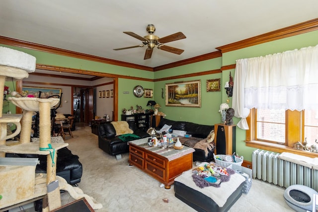 carpeted living area with crown molding, radiator heating unit, and a ceiling fan
