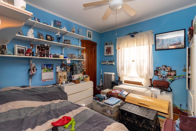 bedroom featuring ceiling fan, radiator heating unit, and crown molding