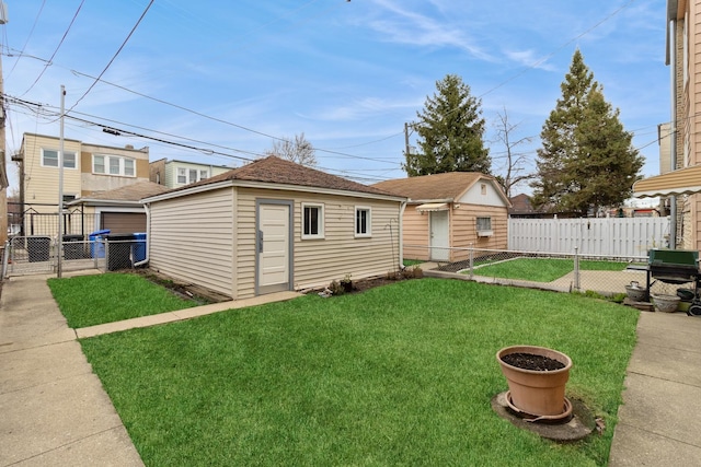 exterior space with an outdoor structure and fence
