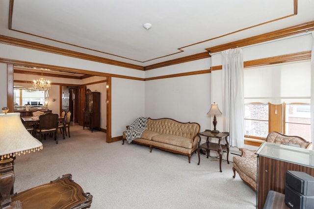 living area featuring carpet flooring, a notable chandelier, and crown molding