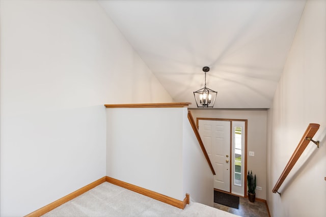 2442 Wilton Ln Unit 2442, Aurora, IL 60502 - entryway with lofted ceiling, baseboards, carpet flooring, and a chandelier