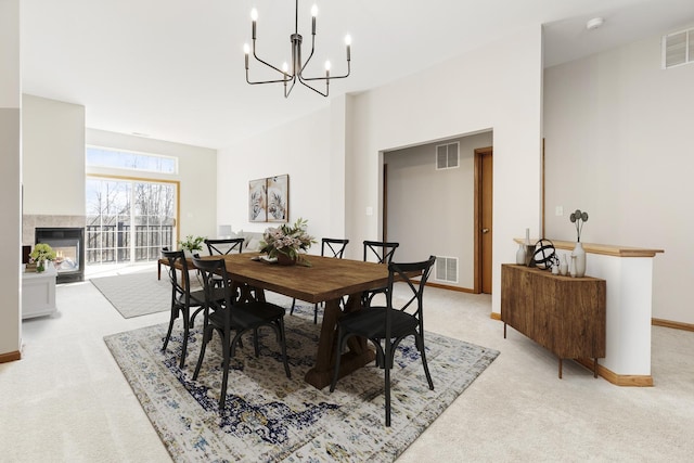 2442 Wilton Ln Unit 2442, Aurora, IL 60502 - dining area with a chandelier, visible vents, and light colored carpet