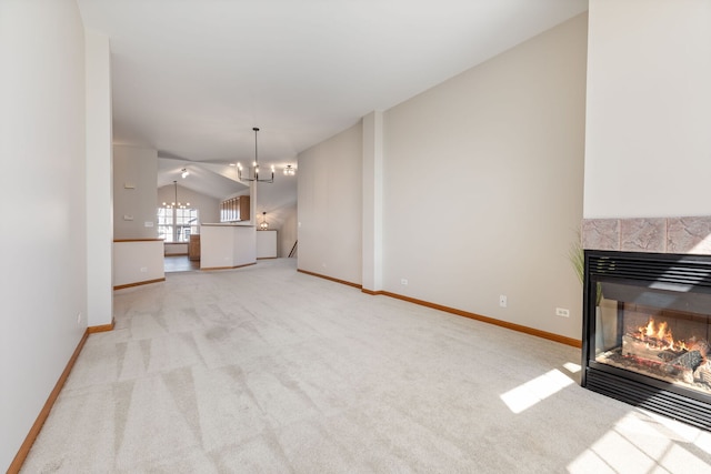 2442 Wilton Ln Unit 2442, Aurora, IL 60502 - unfurnished living room with baseboards, a fireplace, carpet flooring, and an inviting chandelier