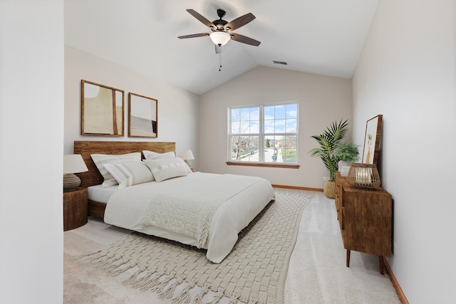 2442 Wilton Ln Unit 2442, Aurora, IL 60502 - bedroom with vaulted ceiling, baseboards, visible vents, light colored carpet, and a ceiling fan