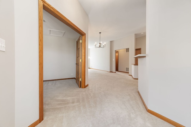 2442 Wilton Ln Unit 2442, Aurora, IL 60502 - corridor with visible vents, baseboards, carpet floors, and a chandelier