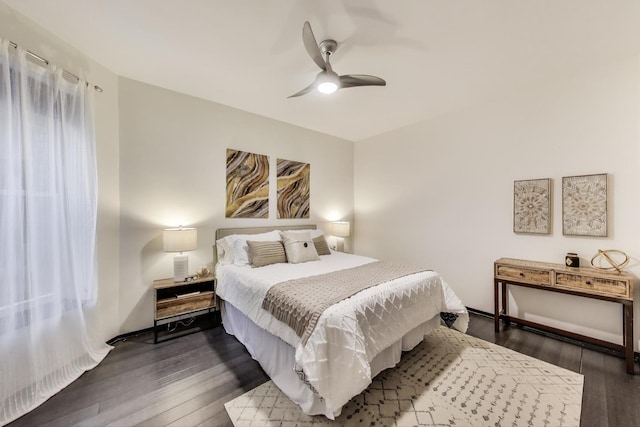 bedroom featuring dark wood-style flooring and a ceiling fan