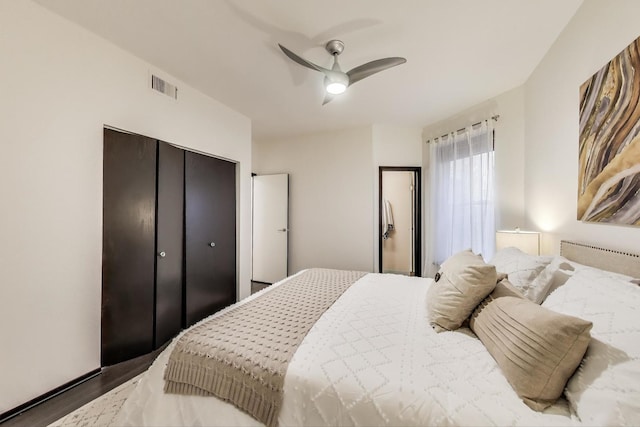 bedroom featuring wood finished floors, a closet, and a ceiling fan