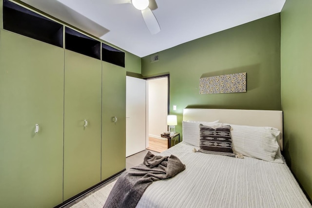 bedroom featuring ceiling fan and a closet