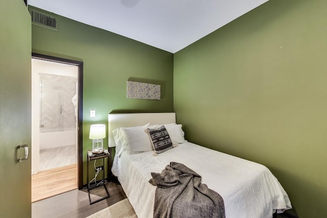 bedroom with wood finished floors