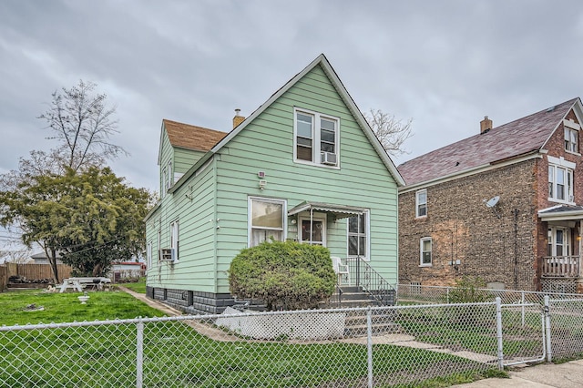 1506 Shields Ave, Chicago Heights, IL 60411 - bungalow with a chimney, a front lawn, and fence private yard