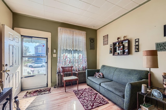 1506 Shields Ave, Chicago Heights, IL 60411 - living area with light wood-type flooring, ornamental molding, and radiator
