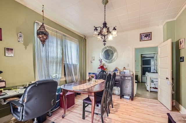 1506 Shields Ave, Chicago Heights, IL 60411 - dining room with light wood-style flooring, a notable chandelier, and ornamental molding