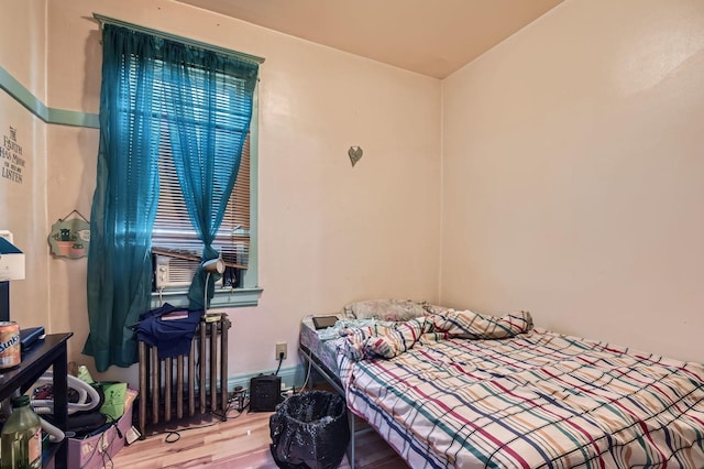 1506 Shields Ave, Chicago Heights, IL 60411 - bedroom featuring radiator heating unit and wood finished floors