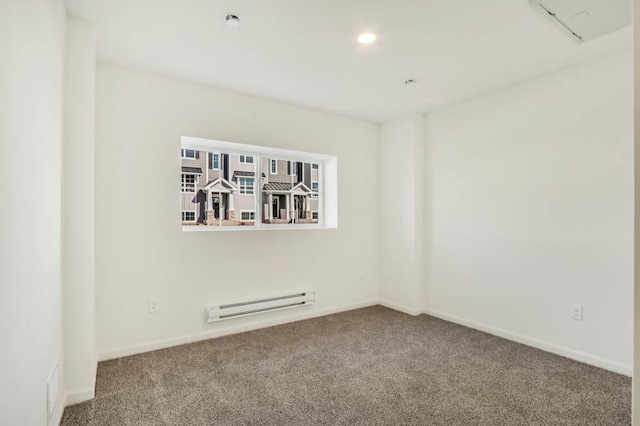 empty room featuring recessed lighting, carpet flooring, baseboard heating, and baseboards