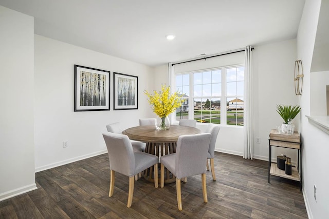 dining area with recessed lighting, dark wood-style flooring, and baseboards