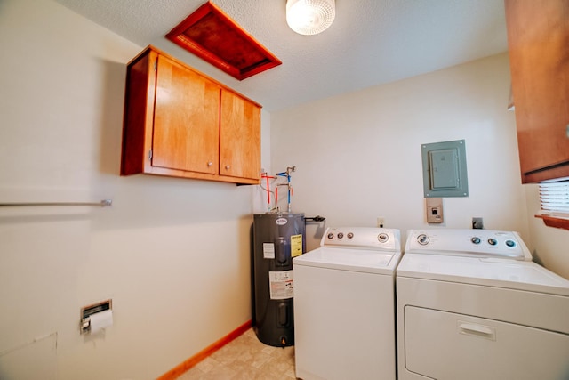 laundry area featuring water heater, electric panel, baseboards, washer and dryer, and cabinet space