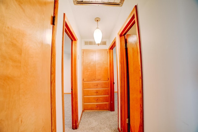 corridor featuring visible vents and carpet
