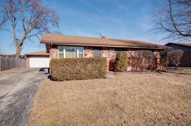 7054 Stanford Dr, Bridgeview, IL 60455 - ranch-style home featuring a front yard, fence, a garage, and aphalt driveway