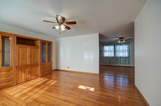 7054 Stanford Dr, Bridgeview, IL 60455 - spare room with light wood-style flooring and ceiling fan