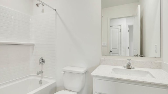 bathroom with washtub / shower combination, toilet, and vanity